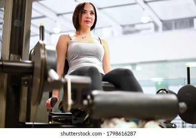 Gym Seated Leg Curl Machine Exercise Woman In The Gym