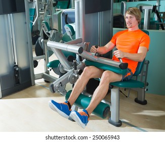 Gym Seated Leg Curl Machine Exercise Blond Man At Indoor