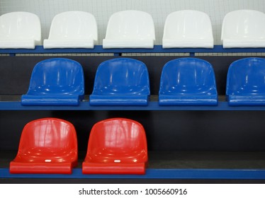 Gym Seats. Empty Plastic Chairs In Stadium