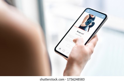 Gym training app in phone. Online personal trainer or video tutorial mockup in smartphone. Home workout with fitness class or digital sport coach. Exercise instruction. Getting fit. Mobile technology. - Shutterstock ID 1736248583