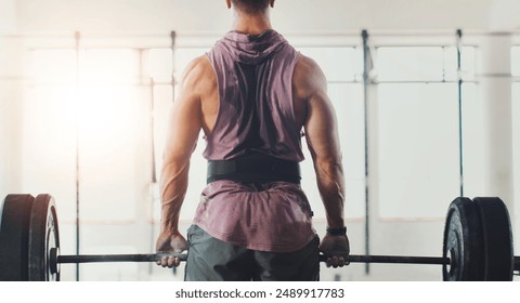 Gym, weightlifting and back of man for exercise, deadlift and strong arm muscle development. Fitness, bodybuilding and serious body builder with health, workout or power training at sports club - Powered by Shutterstock