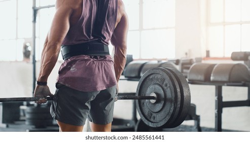 Gym, weightlifting and back of person for exercise, deadlift and strong arm muscle development. Fitness, bodybuilding or serious body builder man with health, workout or power training at sports club - Powered by Shutterstock