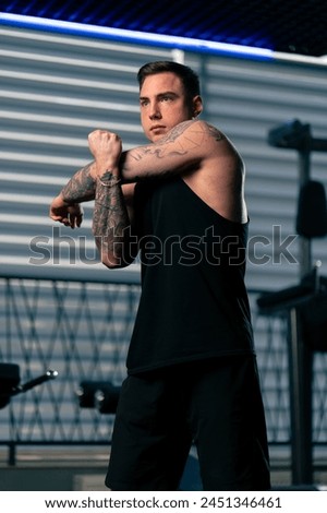 Similar – Image, Stock Photo Young sportsman drinking water after jogging