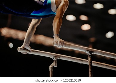 Gymnast Exercise Parallel Bars In Artistic Gymnastics