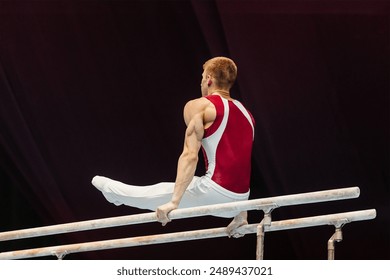 gymnast exercise parallel bars in championship gymnastics, element l-sit in support or through support on 2 bars