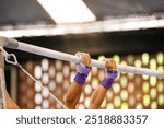 gymnast on the uneven bars during an artistic gymnastics training session in Rio de Janeiro, Brazil.