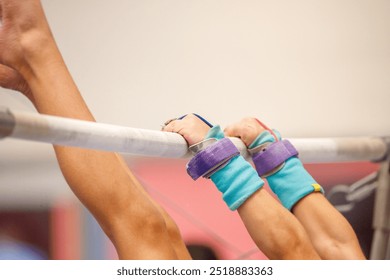 gymnast on the uneven bars during an artistic gymnastics training session in Rio de Janeiro, Brazil. - Powered by Shutterstock