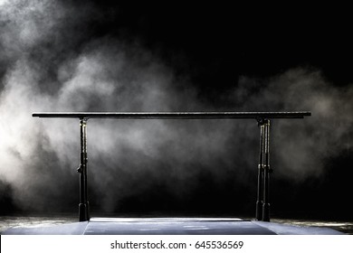 Gymnastic Parallel Bars. Isolated On Black Background With Fog,
