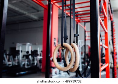 Gymnastic Rings In Crossfit Gym, Workout Background Interior. Motivation.