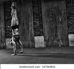 gymnastics crossfit functional girl walking on hands in gym - Powered by Shutterstock