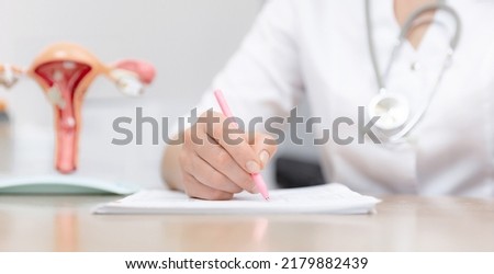 Gynecologist doctor write analyzes, prescription for tablets patient in medical institution, model of female reproductive system, banner.