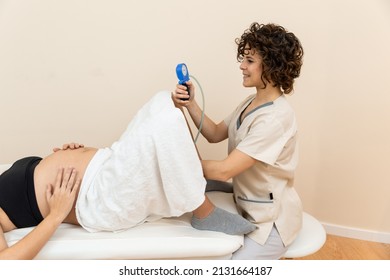 Gynecologist Holding A Pelvic Floor Muscle Exercise Device To Prepare For The Giving Of Birth Of A