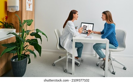 Gynecology, consultation of gynecologist. Gynecologist consulting a woman patient, talking about women's health and diseases of uterus and ovaries