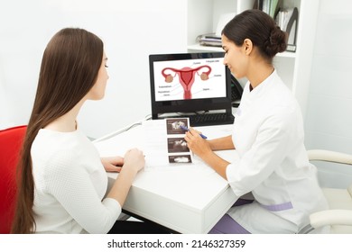 Gynecology, Consultation Of Gynecologist, Women's Health. Gynecologist Showing To Woman Ultrasound Of Her Ovaries During Female Patient Visit To Gynecology