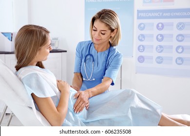 Gynecology consultation. Pregnant woman   with her doctor in clinic - Shutterstock ID 606235508