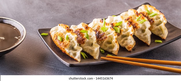 Gyoza or dumplings snack with soy sauce, selective focus, copy space.