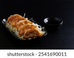 Gyoza Japanese food dumpling isolated in black background