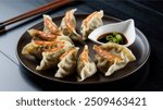 Gyoza : Japanese pan-fried dumplings filled with minced pork, cabbage, and garlic chives, served with a dipping sauce. Inspired by Chinese jiaozi, they’re a popular street food.