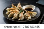 Gyoza : Japanese pan-fried dumplings filled with minced pork, cabbage, and garlic chives, served with a dipping sauce. Inspired by Chinese jiaozi, they’re a popular street food.