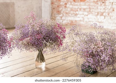 gypsophila flowers in vases in the room - Shutterstock ID 2276459305