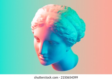Gypsum copy of the ancient statue of Venus de Milo in pastel tone for artists on pink blue background. Plaster sculpture of a woman's face. Art modern poster in soft colors. Love, beauty, feminism.