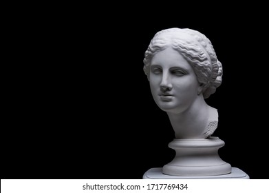 Gypsum Copy Of Ancient White Statue Of Bust Of Venus With Black Background .Plaster Sculpture Woman Face. The Goddess Of Love In Greek Mythology. Renaissance Epoch.