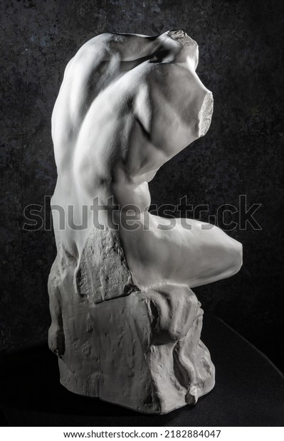 Gypsum copy of Belvedere Torso statue for artists.\
Replica of famous ancient Greek fragmentary marble sculpture of a\
male nude from Vatican Museums. Template design for art, dj,\
fashion, poster, zine.