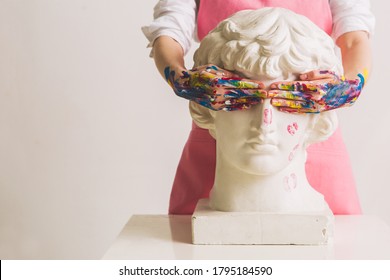 Gypsum Statue Of Antinous Head. Plaster Statue In Woman's Hands. Concept Photography About Art And Gender. Copy Space