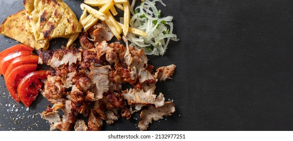 Gyro Greek Sliced Meat Food, Traditional Street Food, Ethnic Dish, Pita Bread And Tzatziki Yogurt On Black Color Background, Top View, Banner, Copy Space.