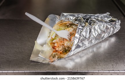 Gyro Wrapped In Foil From NYC Food Truck With Fork