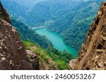 Ha Giang, Vietnam - 04.28.2024: Beautiful view of dammed green river over Mã Pí Lèng Pass, North of Vietnam. River at the bottom of a cliff from a steep rocky mountain. The Ha Giang Loop Tour.