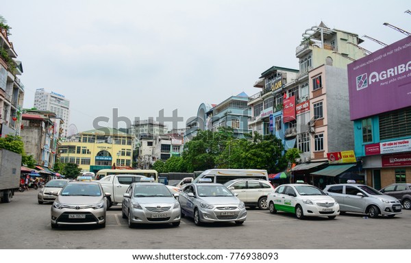 Ha Long, Vietnam - May\
23, 2016. Cars on street at downtown in Ha Long, Vietnam. Ha Long,\
a city on Vietnam northern coast, is a jumping-off point for Ha\
Long Bay.