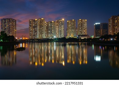 Ha Noi, Vietnam, October 07 2022: Illuminated Modern Apartments, As Known As A Part Of Urban Life, Are Reflected At Sunset Moment.