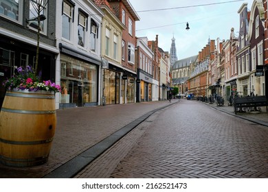 Haarlem, Holland, May 23, 2022: Wide angle view of Warmoesstraat shopping street in Haarlem.  Grote Kerk church in the background.