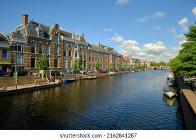 Haarlem, Holland, May 24, 2022: Wide angle view Nieuwe Gracht canal in Haarlem on a sunny day viewed from the Kruisbrug bridge.