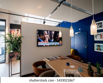 Haarlem, Netherlands - Aug 17, 2018: Modern Hotel Lobby With Digital Flat Screen Tv Showing CNN News Channel With Braking News Music Legend Aretha Franklin Dies At Age 76 - Featuring Barack Obama