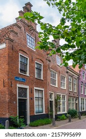 Haarlem, The Netherlands - March 2022: Cozy green little street in Haarlem. Concept social inclusion and climate change. Street view generic architecture Haarlem typical Dutch style buildings.