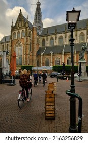 Haarlem, Netherlands - May 24. 2022: Cyclists in the main market sqaure (Grote Markt) in the city center of Haarlem.