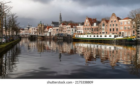 Haarlem, The Netherlands on January 2, 2021; Spaarne river with historical buildings in old Haarlem at night.