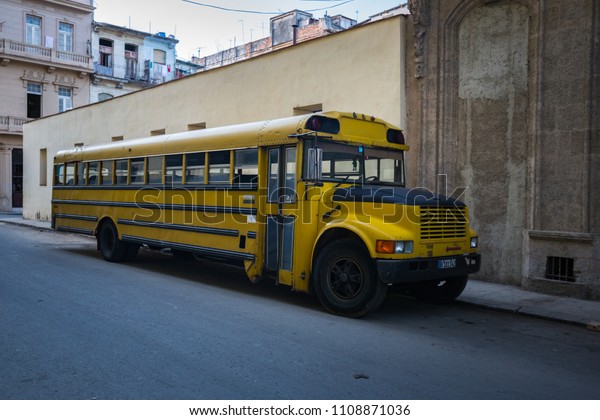 HABANA, CUBA-JANUARY\
12: Yellow bus on January 12, 2018 in Habana, Cuba. Yellow bus on a\
street  of Habana