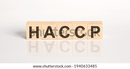 HACCP word from wooden blocks on white desk