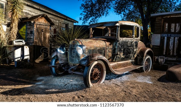 Hackberry,\
AZ/U.S. - June 19, 2018 Old Rusty Car at Night Along Historic Route\
66 At Antique General Store With\
Lights.