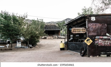 Hackberry, AZ/USA - June 16, 2018: Old Rusty Antique Route 66 Maintenance Shack With Vintage Performance Stage In Background.