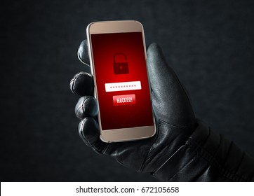 Hacked. Cyber security and online fraud concept. Mobile hacker and criminal login to personal information and data with smartphone. Thief with black leather gloves. - Powered by Shutterstock