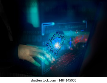 Hacker attack laptop computer with background icon binary, shield and padlock,concept preventing website attacks by keeping financial information with block chain technology,cyber security