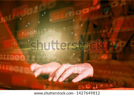 Hacker attack laptop computer with background icon binary, shield and padlock,concept preventing website attacks by keeping financial information with block chain and internet of things(iot)technology