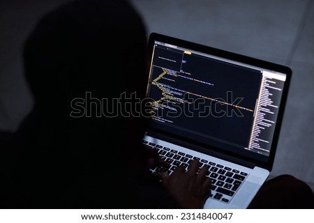 Hacker, code and cyber security with person and laptop screen for ransomware, programming and phishing. Coding, technology and crime with programmer typing for fraud, network system and data at night