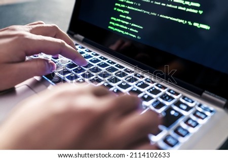 Hacker code in laptop. Cyber security, privacy or hack threat. Coder or programmer writing virus software, malware, internet attack or developing digital design. Green web data in computer screen.