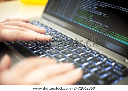 Hacker code on a laptop, highlighting issues of cybersecurity, privacy threats, data leaks and server processes. A cybersecurity expert identifies vulnerabilities and scrutinize virus code and malware