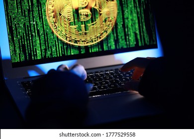 Hacker with computer hacking and stealing data information, Selective focus image on keyboard, Bitcoin logo and binary code as background. Bitcoin cryptocurrency security and privacy issues. - Powered by Shutterstock - Get 15% off with code: PIKWIZARD15